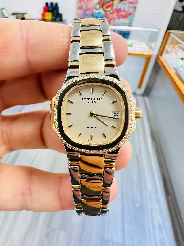 Men's dress watches with slim profile   Patek Philippe Nautilus "Tiffany & Co. 4700/61JA Stainless And Yellow Gold Factory Diamond Bezel  PreOwned